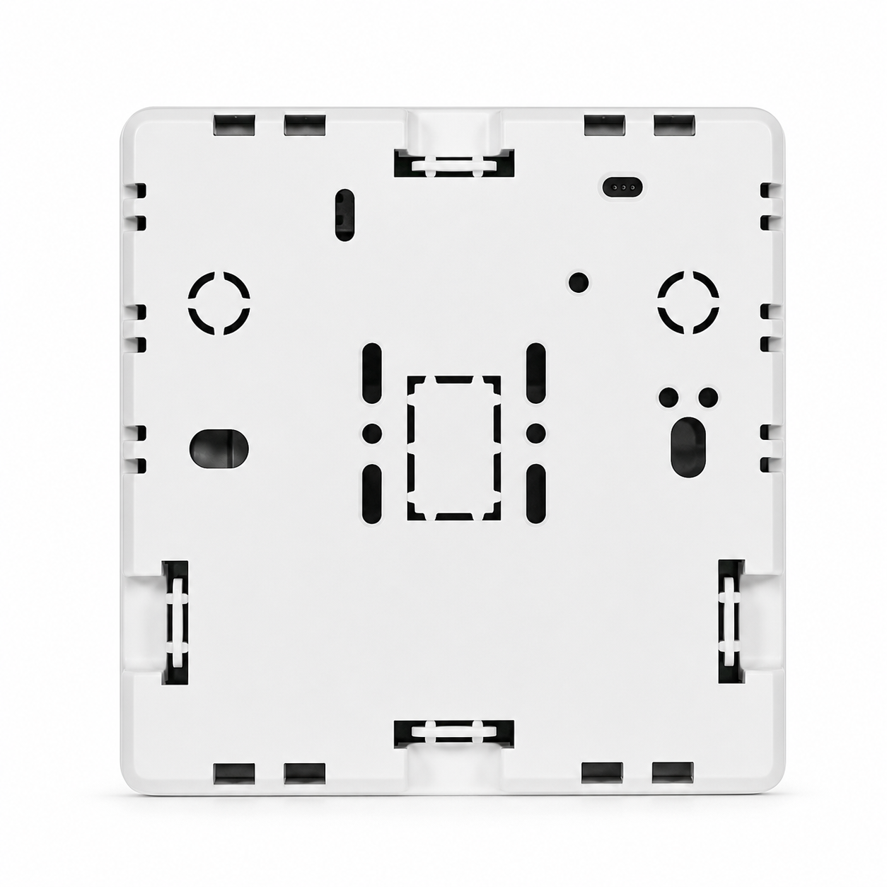 Dos du thermostat sans fil NéoFree Comfort sur fond blanc, avec platine de fixation murale et encoches de montage.
