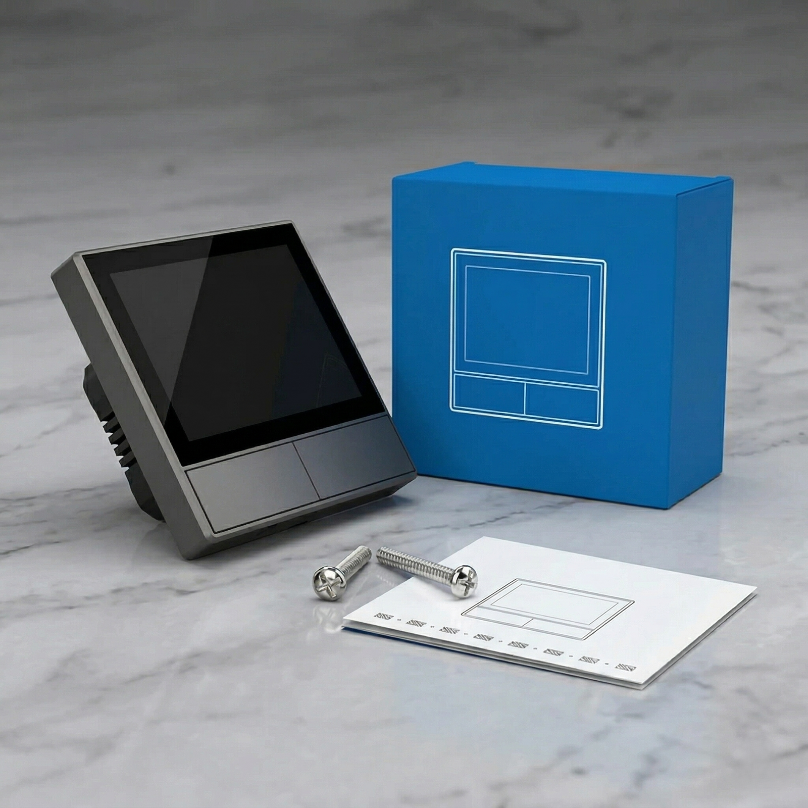 NéoHub Touch noir avec boîte bleue, accessoires et notice.