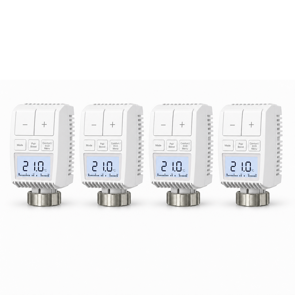 Lot de quatre vannes thermostatiques compactes NéoMini Comfort 2 sur fond blanc, avec écrans LED et molettes métalliques.