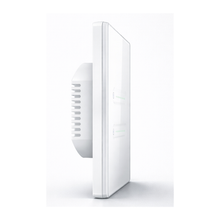 Variateur tactile NéoSlide Essential Wi-Fi blanc vu de profil avec module encastrable sur fond studio blanc.