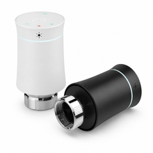 Studio packshot of white and black smart thermostatic radiator valves with metal connectors