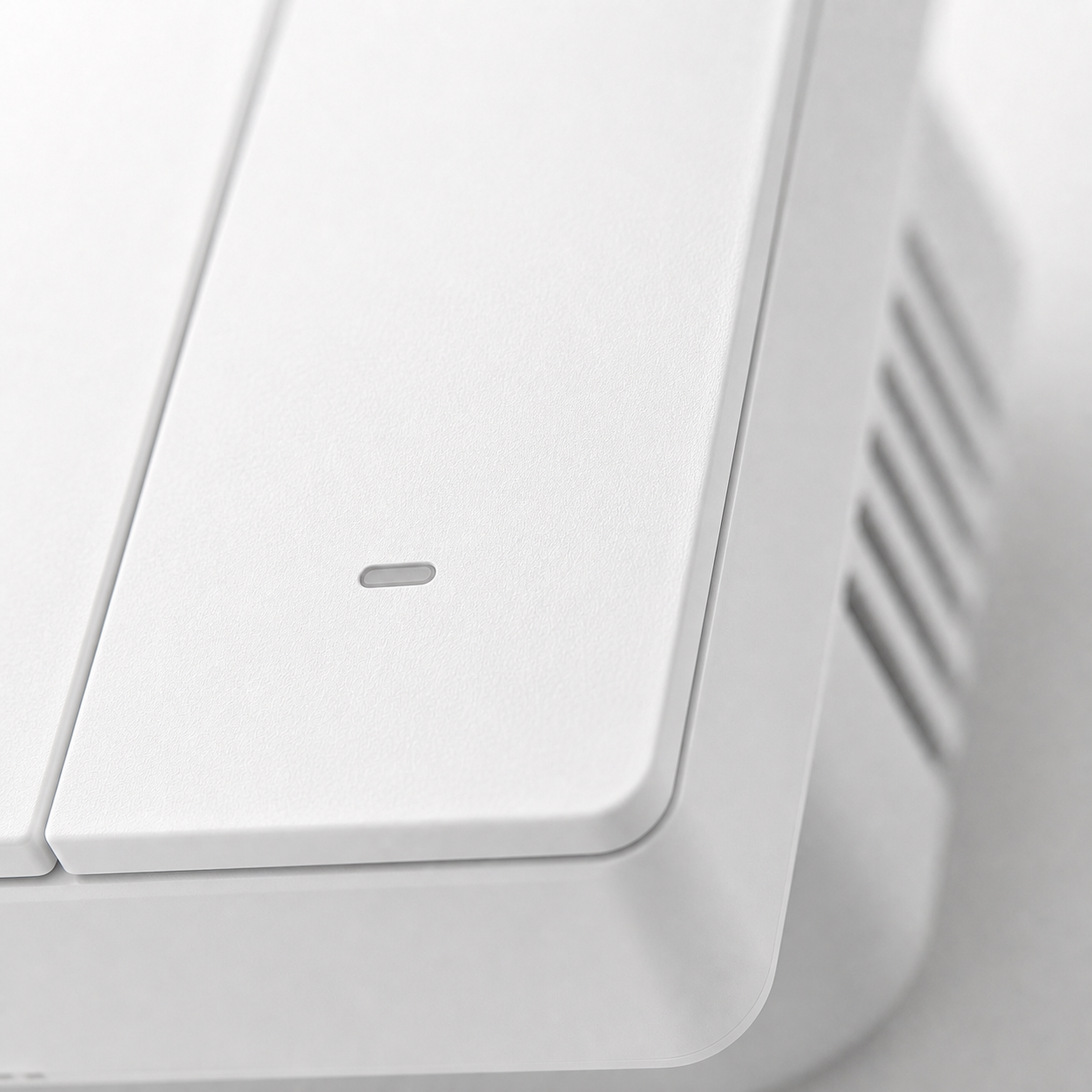 Close-up detail of NéoSwitch M5 Matter Pro mechanical button edge and side vents