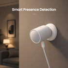 Wall-mounted white Zigbee radar presence sensor in a modern room