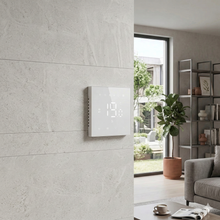 Thermostat mural blanc avec réglage précis de la température.