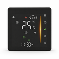 Thermostat mural tactile NéoGlass Comfort noir absolu avec écran LED couleur et façade effet verre.