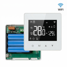 Thermostat Wi-Fi blanc avec compartiment à piles et circuit électronique visible.