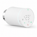 Vanne thermostatique NéoSoft Curve Comfort blanc pur avec écran LED, boutons tactiles et bague de fixation métallique.