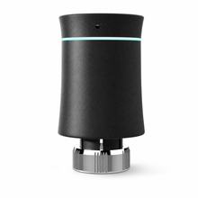 Vanne thermostatique NéoSoft Curve Comfort noir absolu vue arrière avec anneau lumineux turquoise et bague métallique.